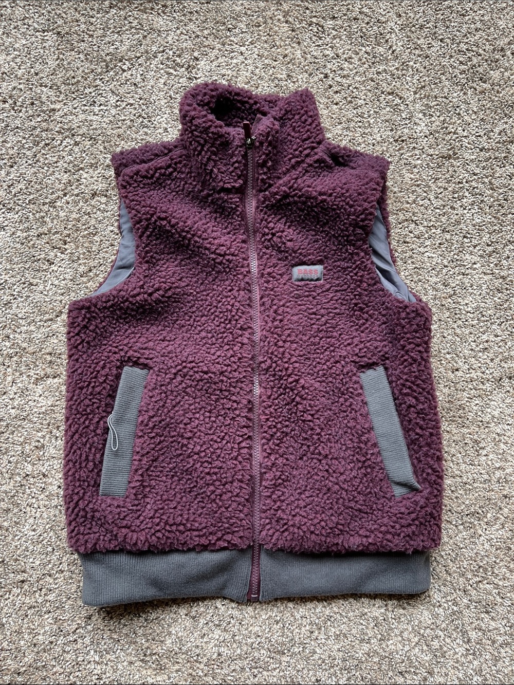 Bass Outdoor Women’s Sherpa Vest in Plum size XS with 2 front zipper pockets.